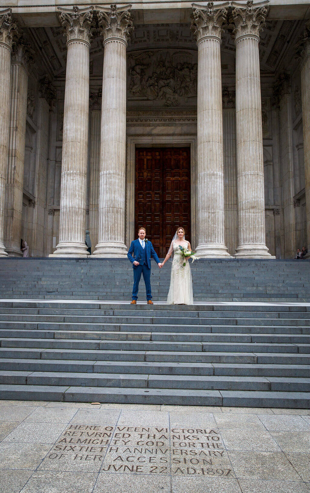 Bride and Groom portrait standing on steps of St Pauls