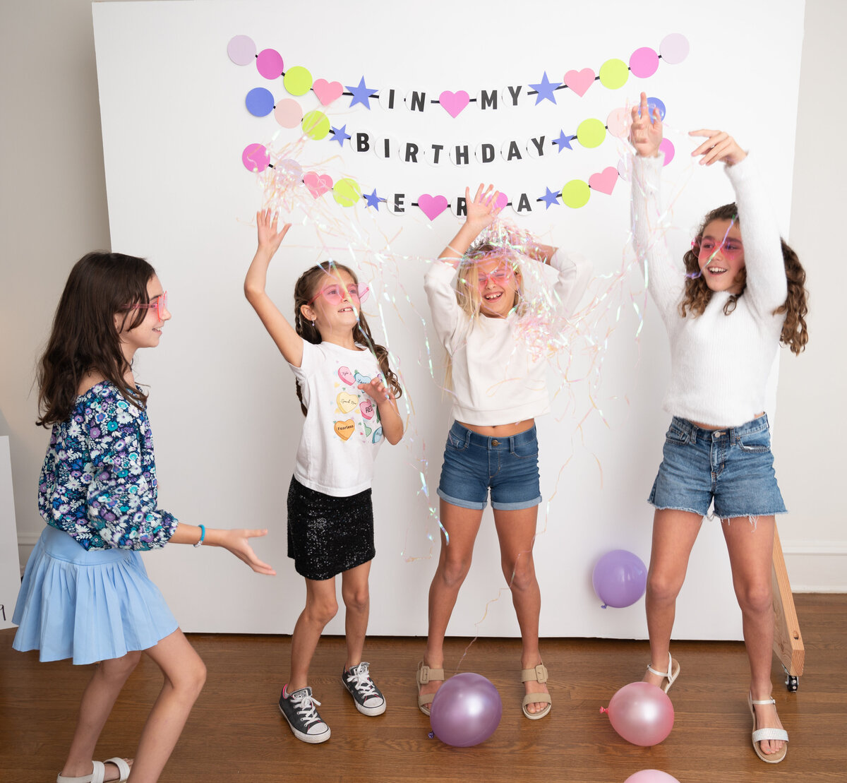 4 girls with4 girls celebrating at a taylor swift themed birthday party