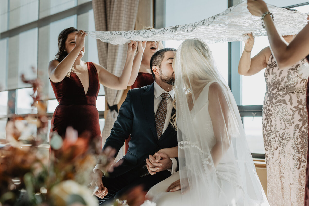 Photographers Jackson Hole capture bride and groom kissing