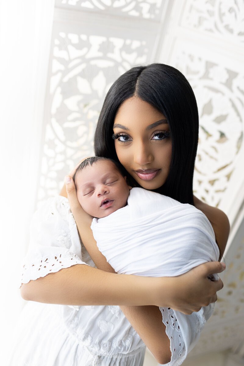 Mom holding newborn baby taken by nj photographers Ally Kimpton Photography