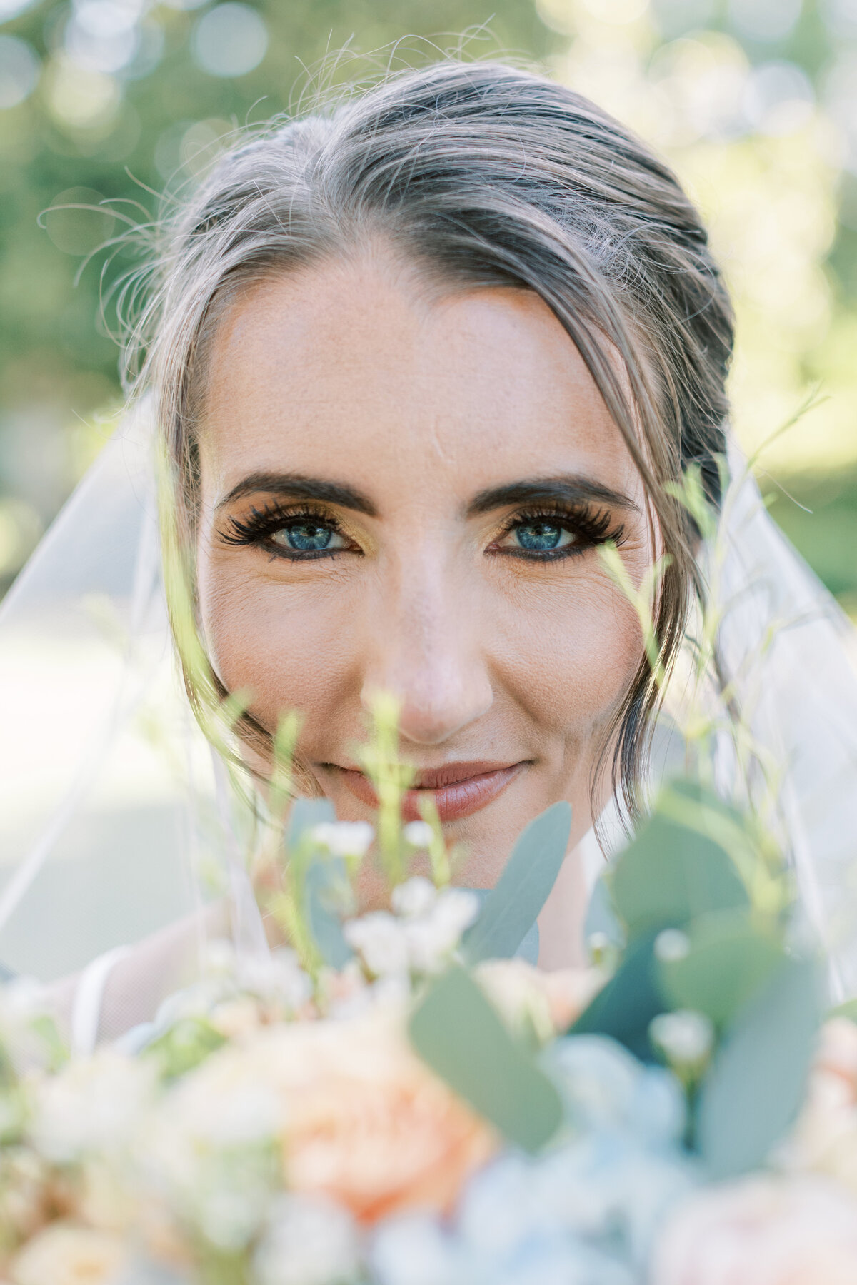 A bride has beautiful blue eyes.