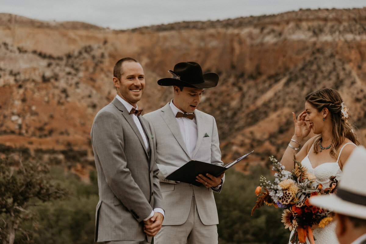 intimate wedding eremony at Ghost Ranch in front of red rocks