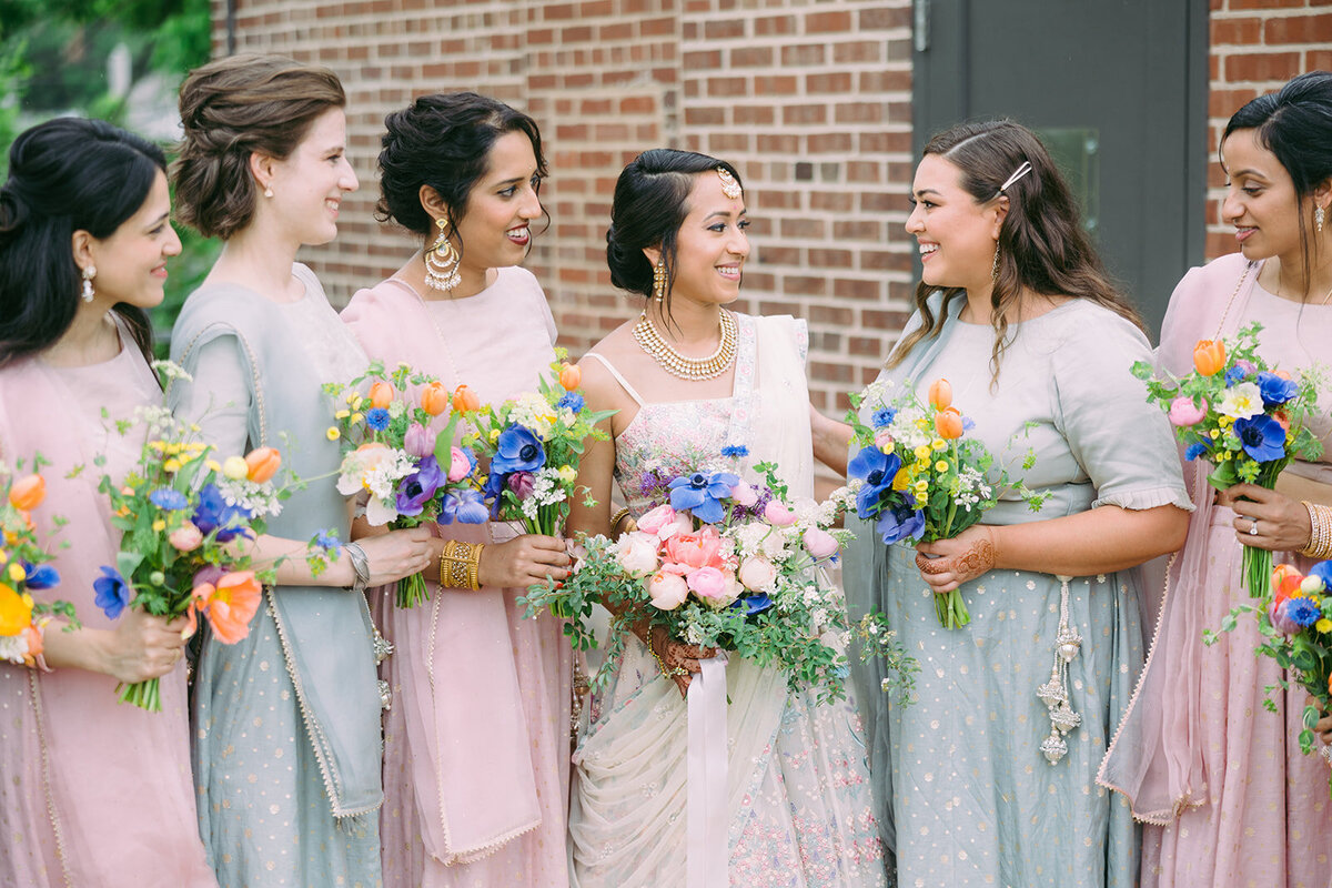 Fuschia and lavender wedding flowers with silk ribbons. Creative flower bouquets for weddings and special events at venues in Kent Island, MD, Tilghman Island, MD and Chestertown, MD.