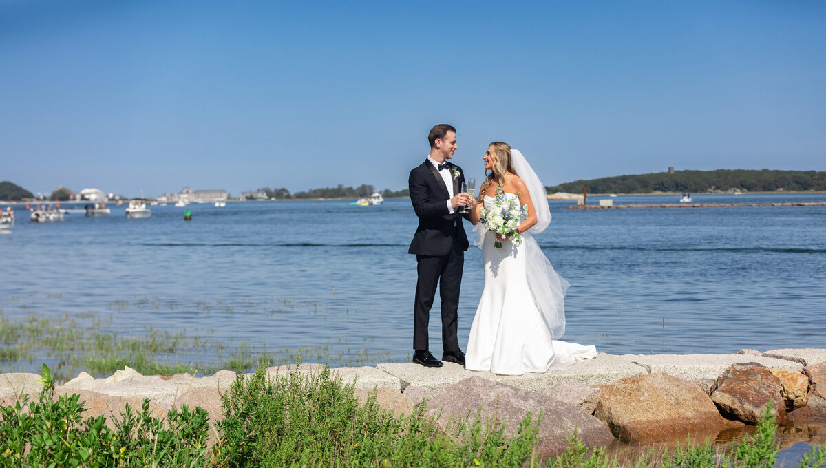 cohasset-wedding-pinehills-pavilion-lisa-gilbert-photography-bride-and-groom-with-view-of-harbor