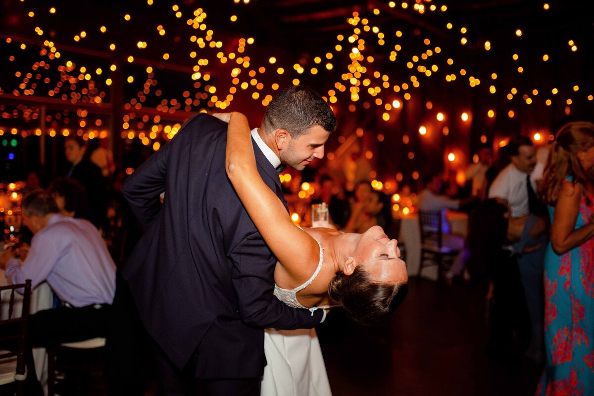 Husband and wife dance during their wedding reception in Stonington, CT.