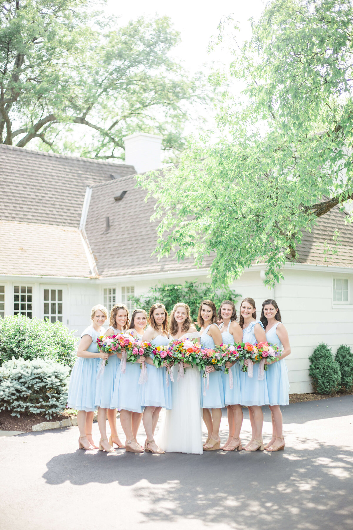 Bride-and-bridesmaids-outside-on-wedding-day-Bethany-Lane-Photography-3