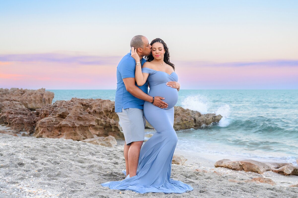 Soft and elegant beach vacation maternity session at The Four Seasons Resort Palm Beach before baby arrives.