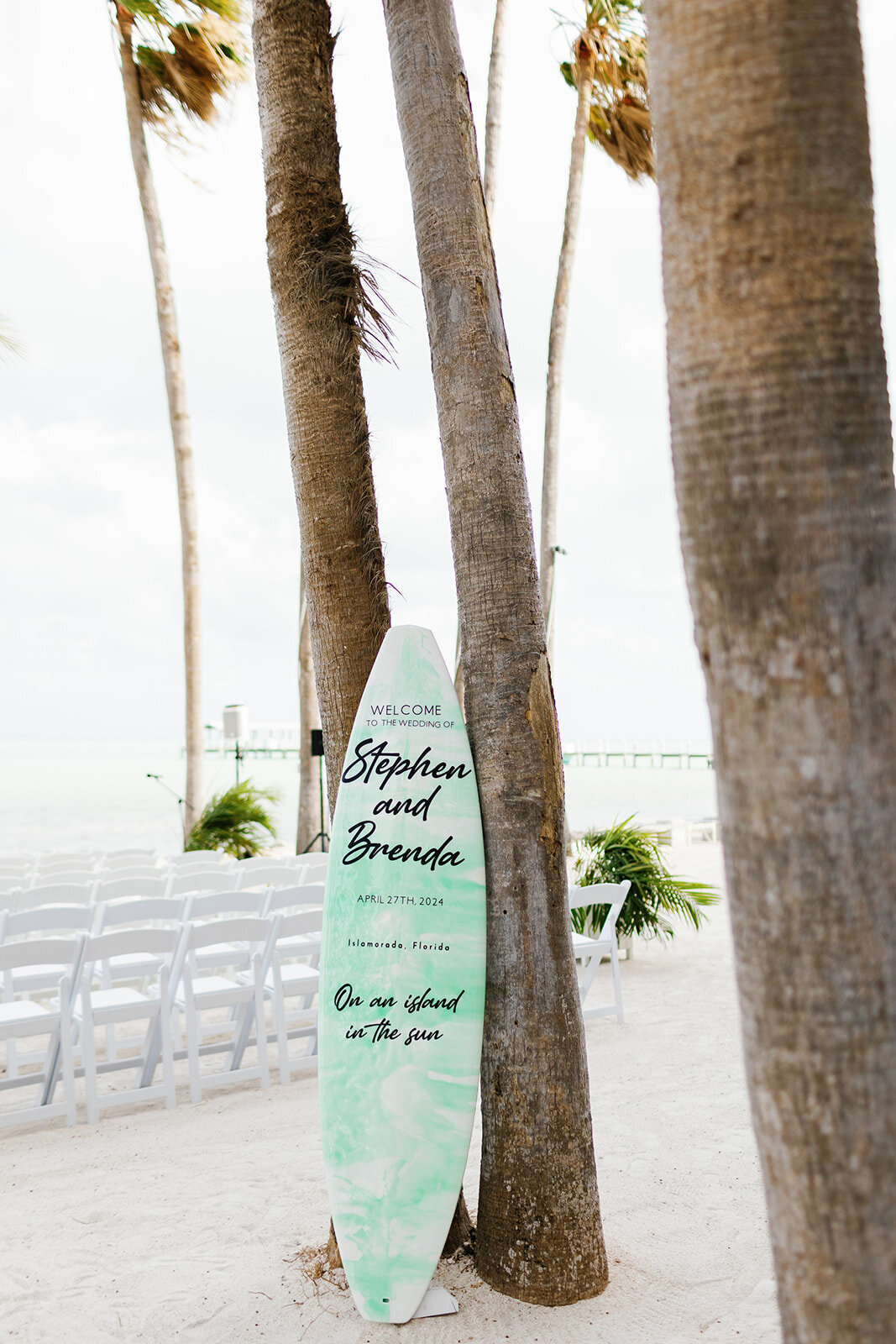 Personalized wedding decor featuring Brenda & Stephen’s names on a tropical surfboard at Cheeca Lodge.