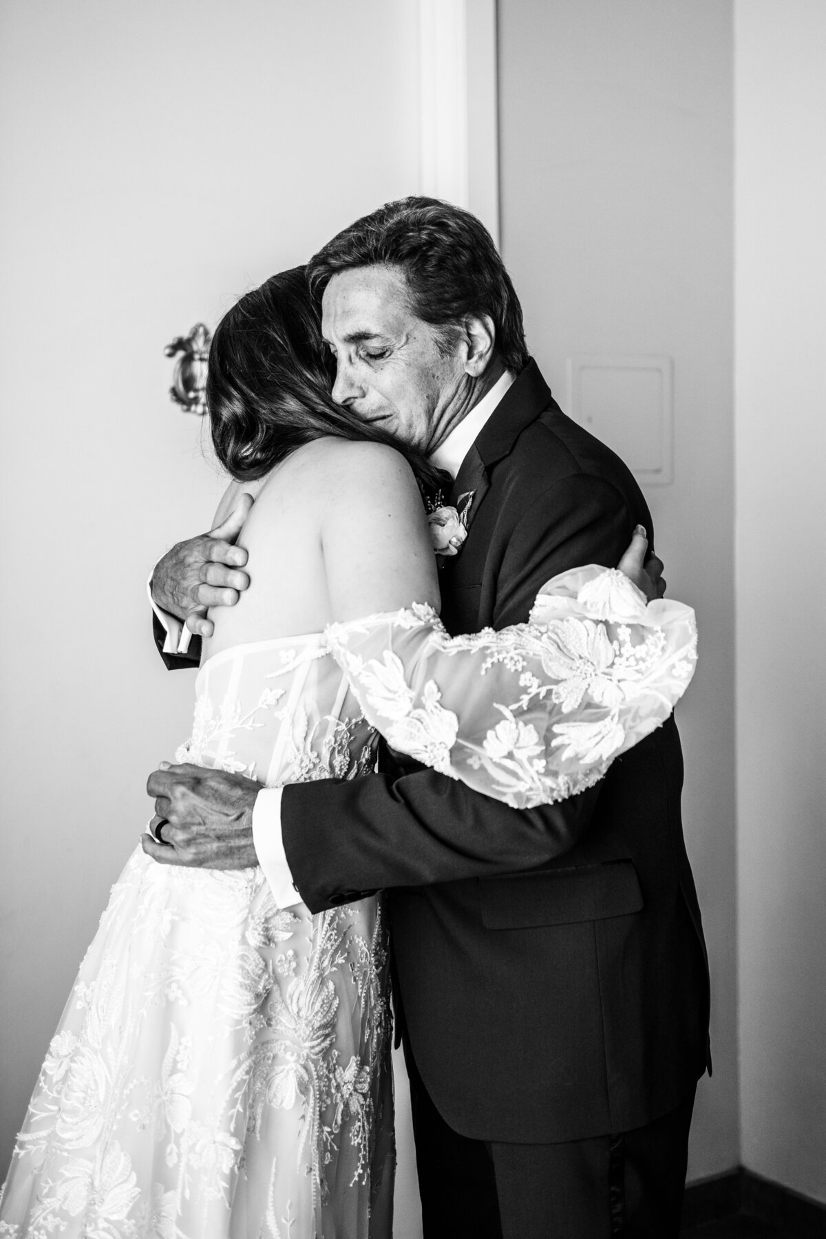Bride hugging her father black and white Soho63 Chandler wedding