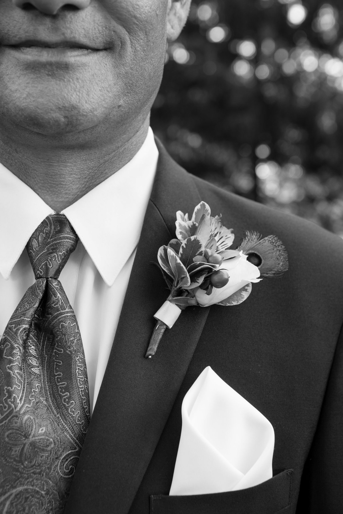 grooms flower shoulder shot black and white photo