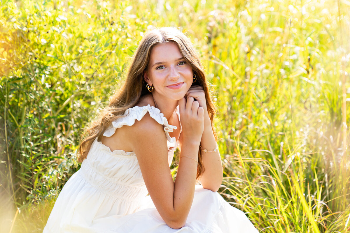 Senior pictures in a field