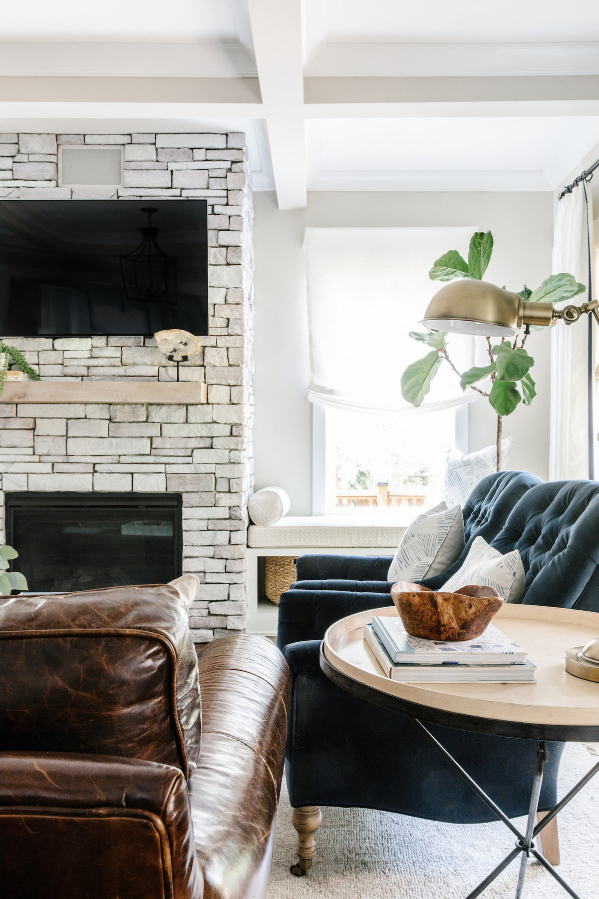 Light-and-bright-living-room-painted-stone-fireplace-with-window-seat-02