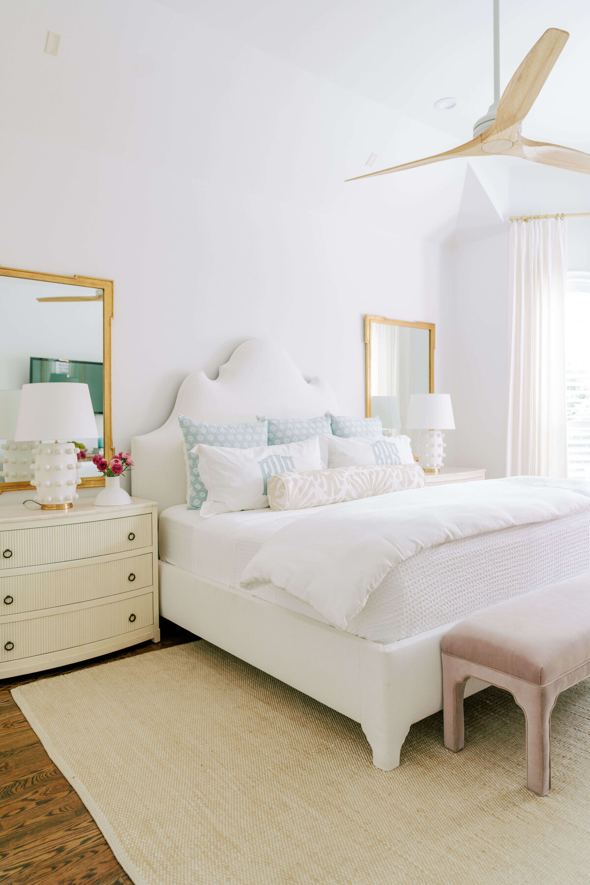 oyster creek studios hause white bed and side table in bedroom