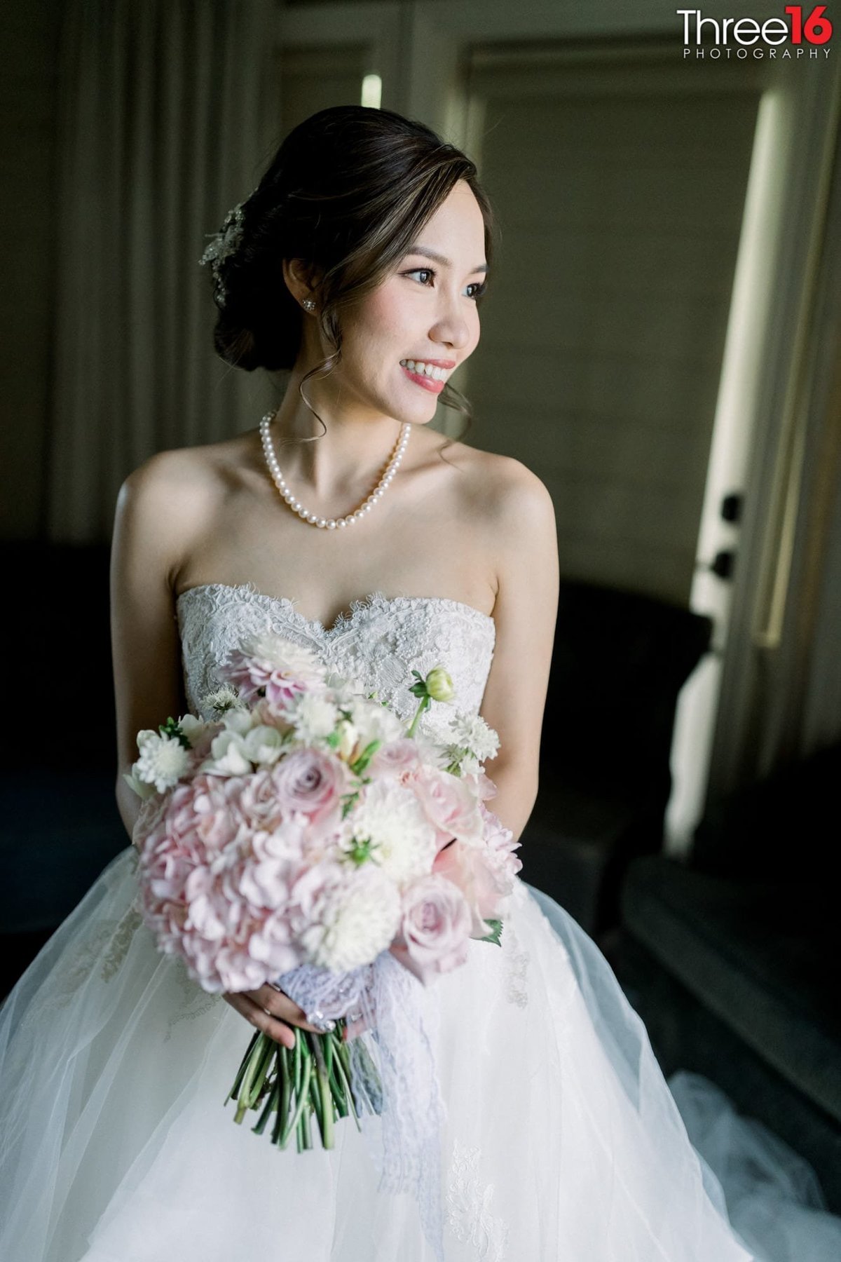 Beautiful Bride poses with her bouquet