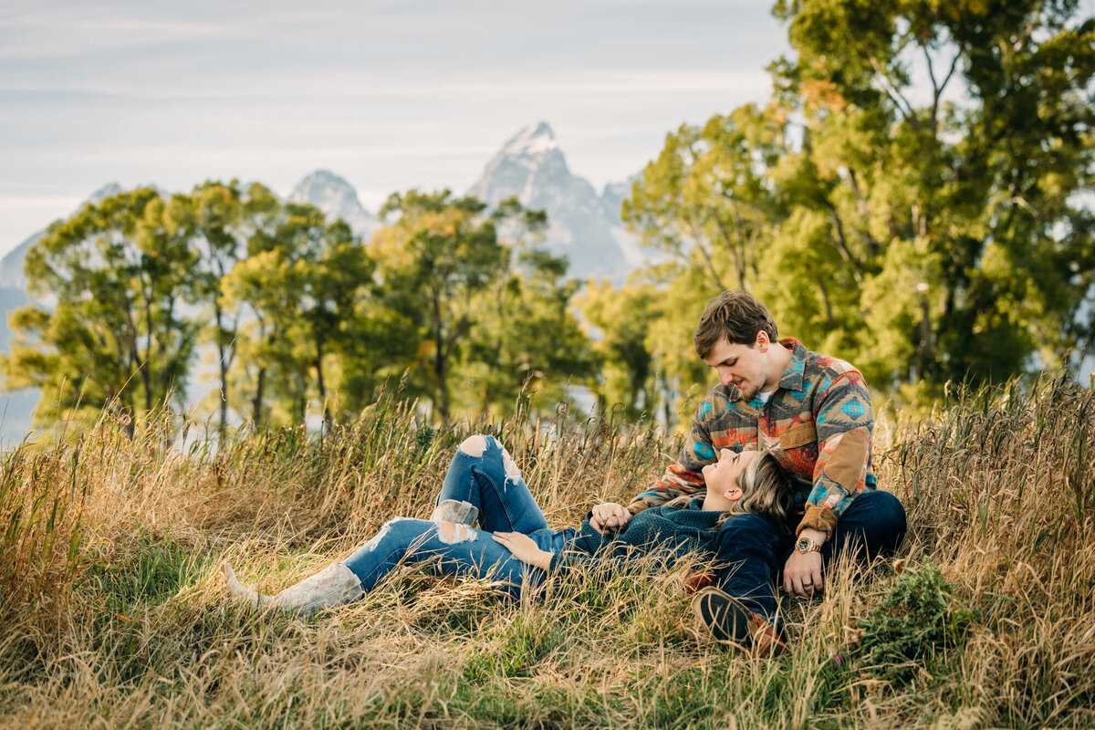 Grand Teton National Park Elopement Mormon Row TA Moulton Barn couple with tall grass and trees