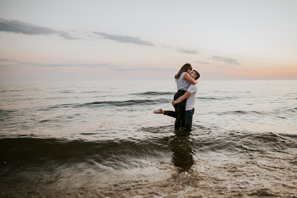 couple in water lake michigan engagement