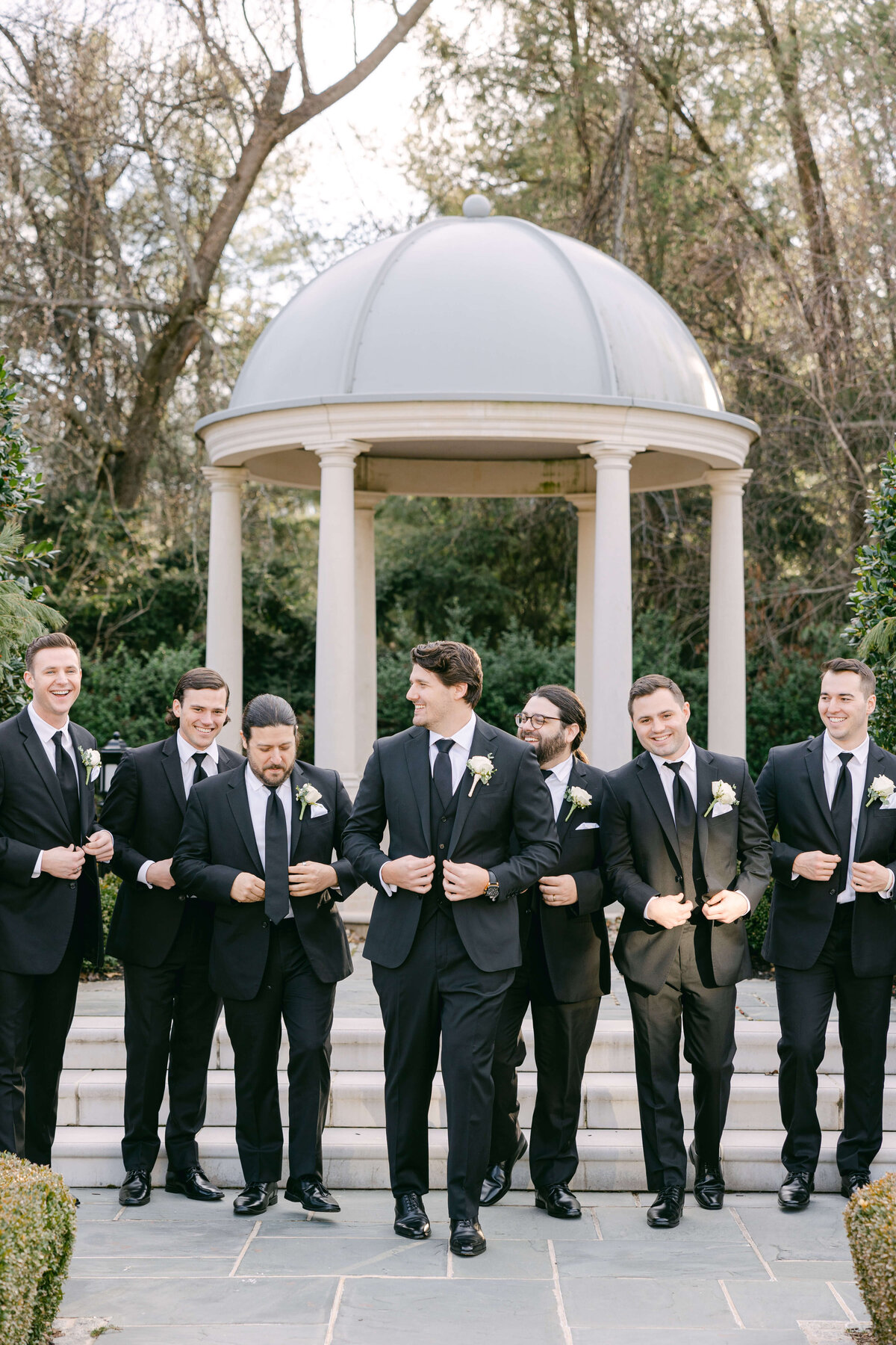 groomsmen walking outside at park chateau