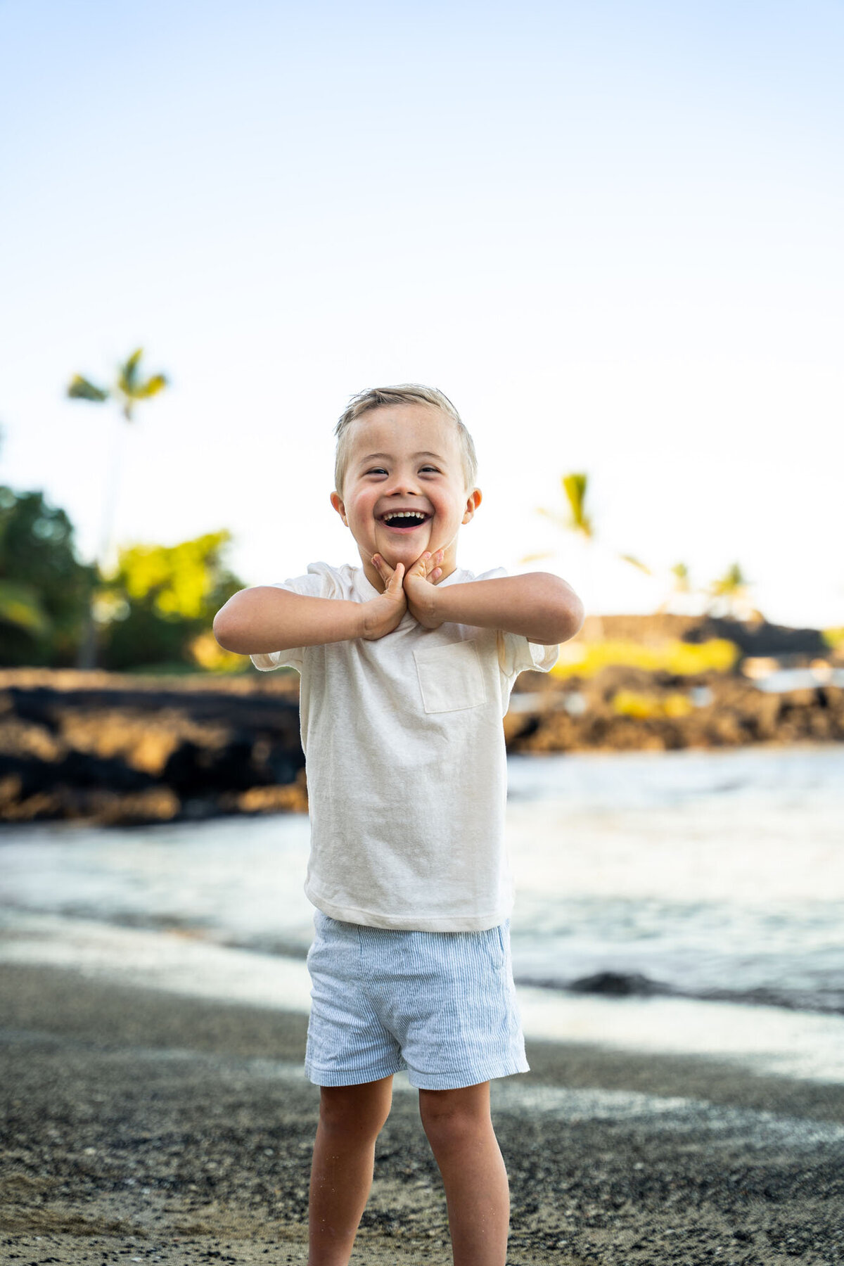 Boy posing for family photos on the big island