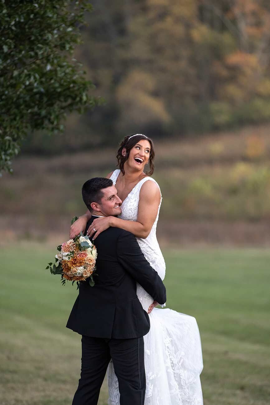 Fun-bride-and-groom-photos-at-outdoor-wedding