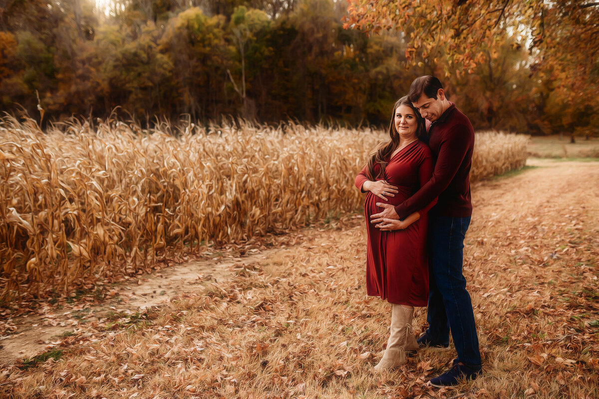 Expectant parents embrace during Maternity Portrait Session at Biltmore Estate in Asheville, NC.