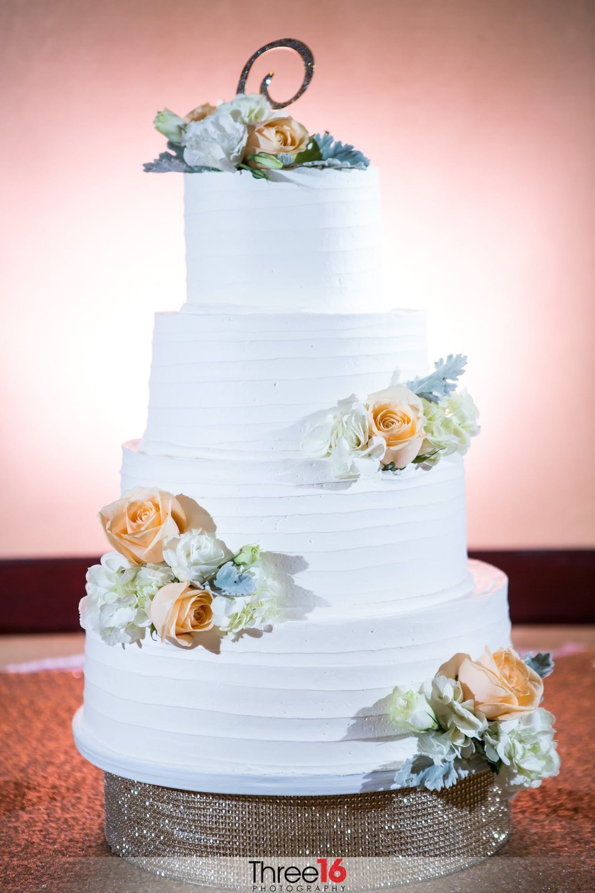Beautiful 4-tiered white wedding cake