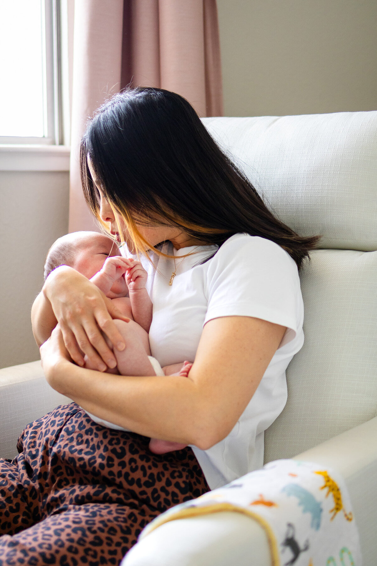 Intimate newborn moment with mom snuggling baby in nursery — Bay Area Newborn Portfolio - Ellobelle Photography Family Photographer