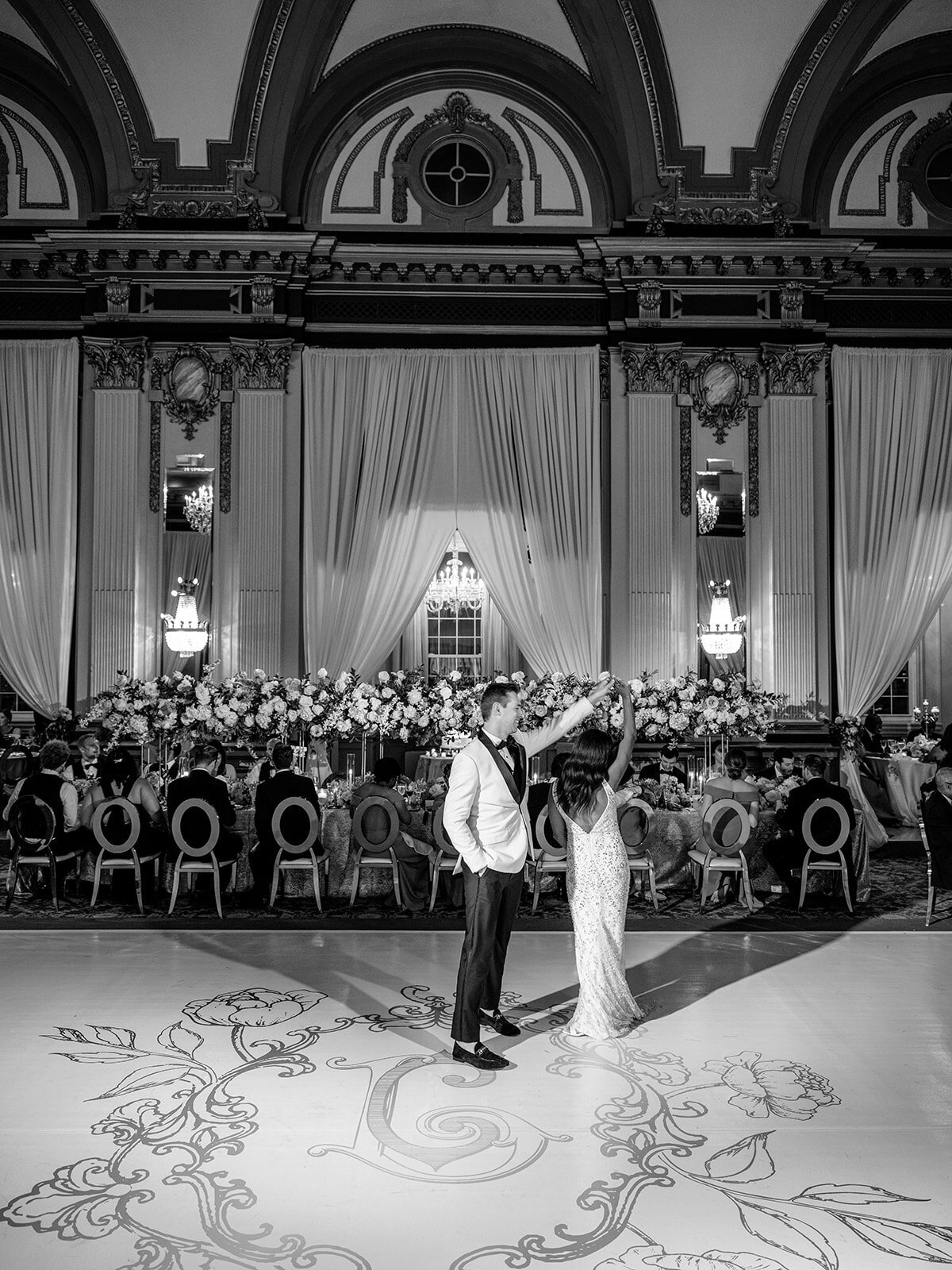 monogrammed floral dance floor at luxury wedding belvedere hotel baltimore