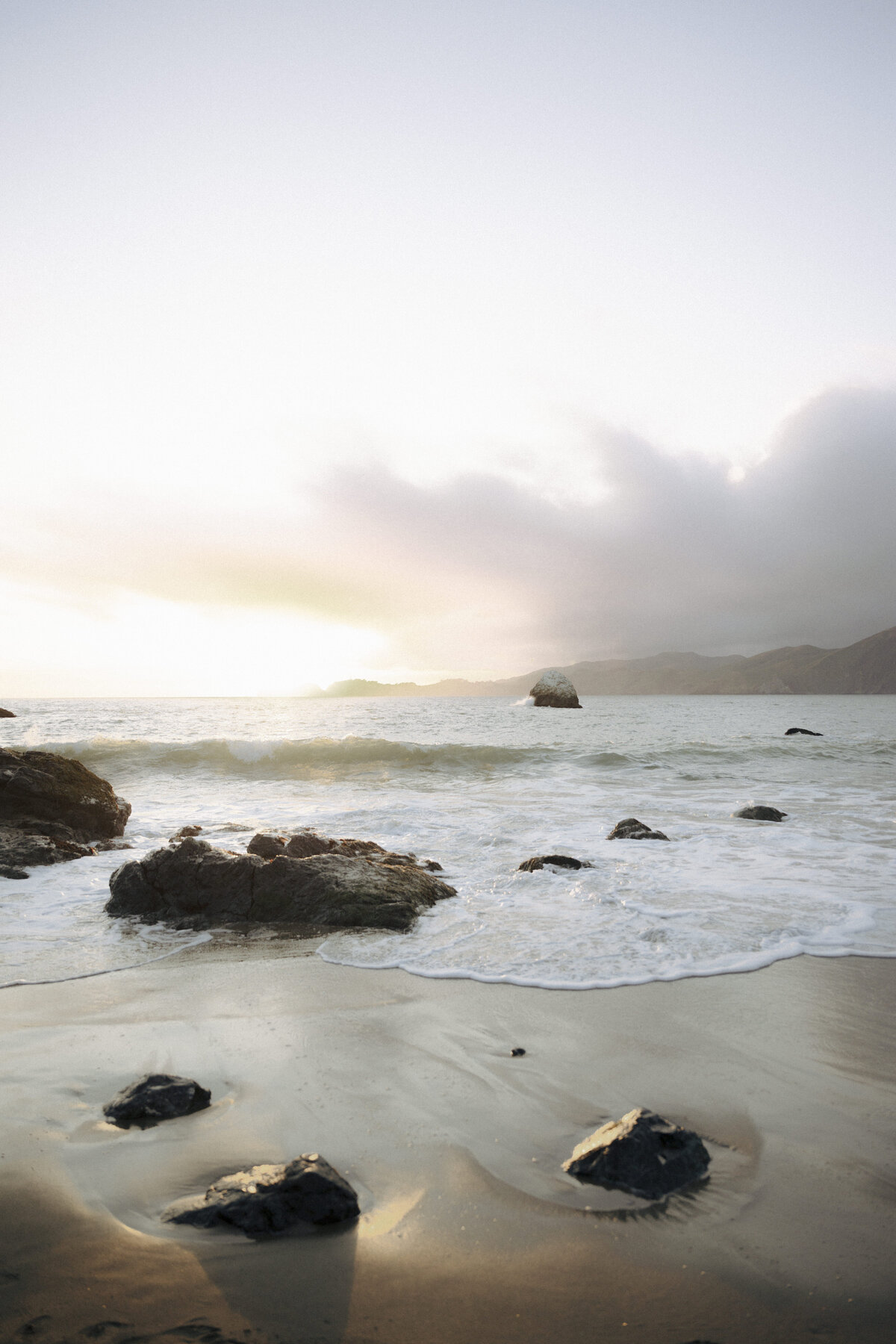 Bride and Groom at Marshall's Beach in San Francisco, California at sunset