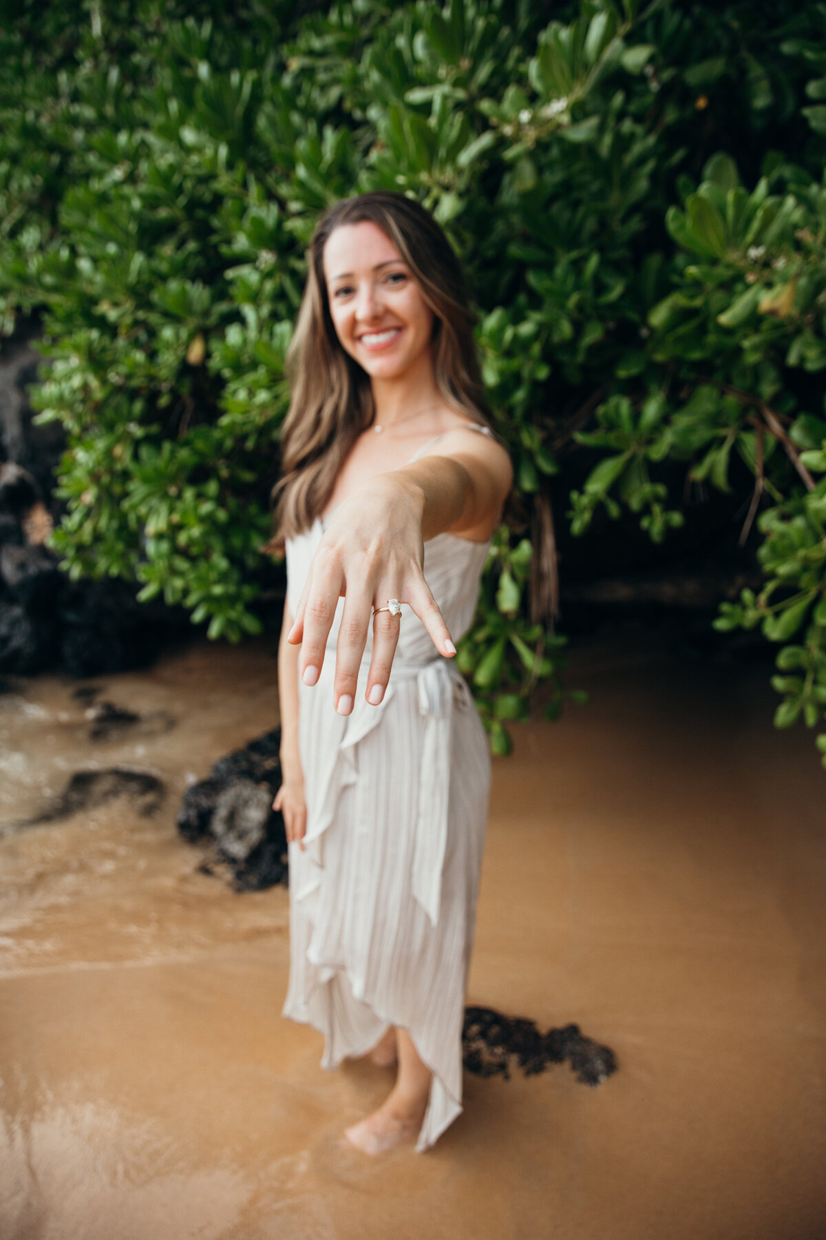 Hawaii Engagement Photographer captures woman showing ring