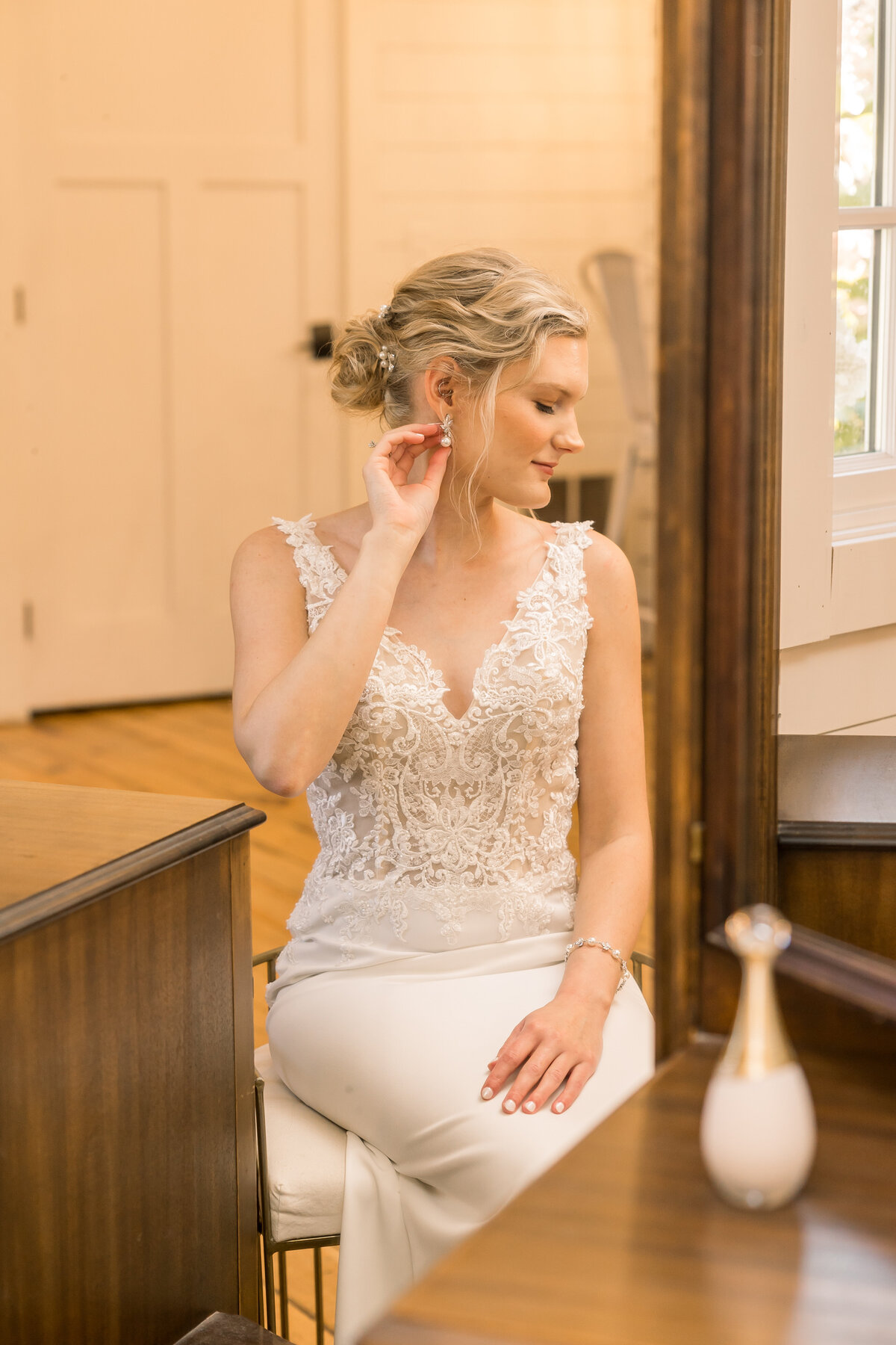 Bride getting ready for her wedding day at Gathered Oaks wedding venue in Alexandria Minnesota