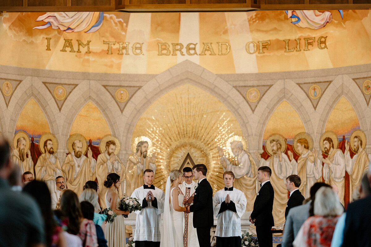 bride and groom standing together smiling