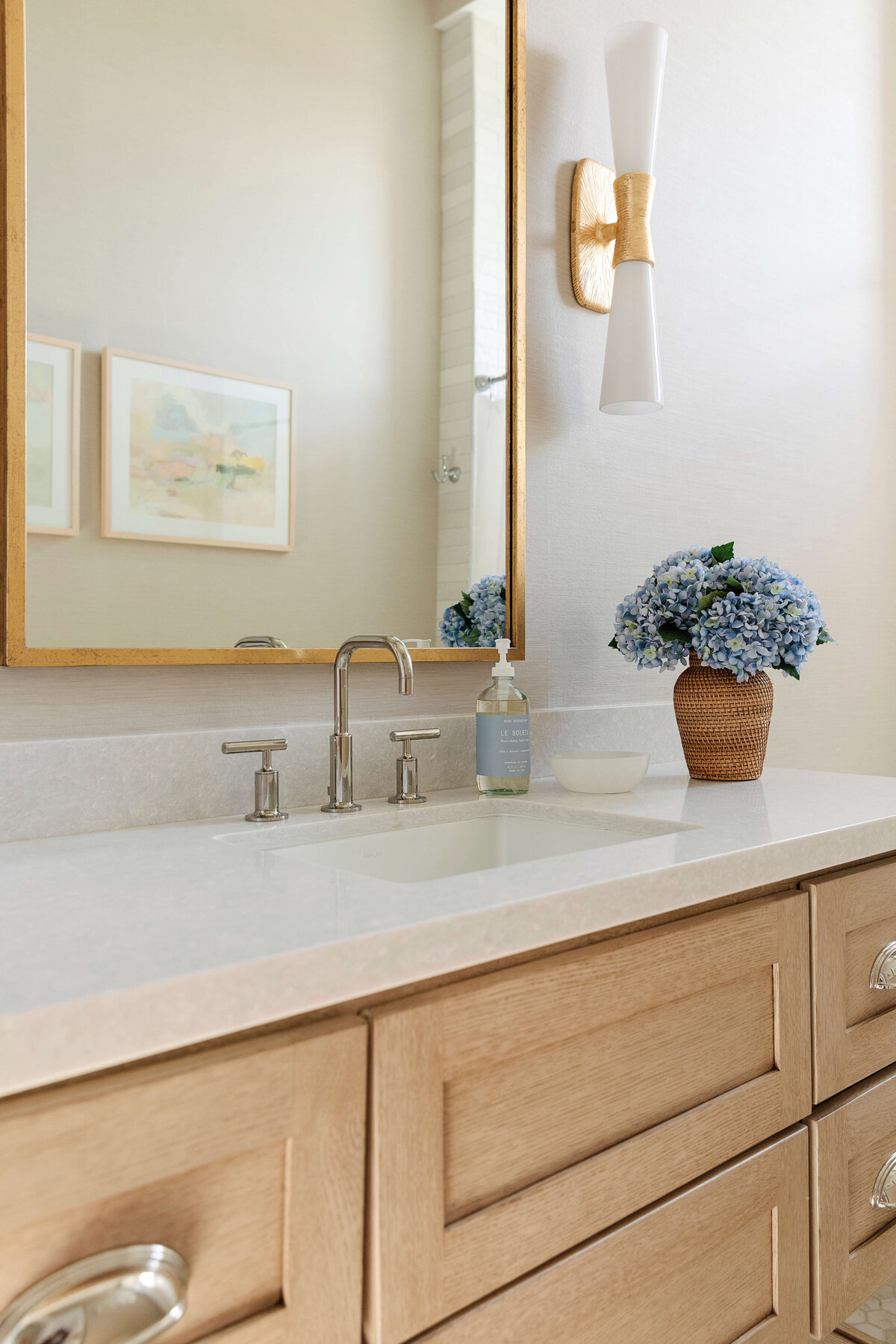 oyster creek studios hughes wooden vanity with gold mirror in bathroom