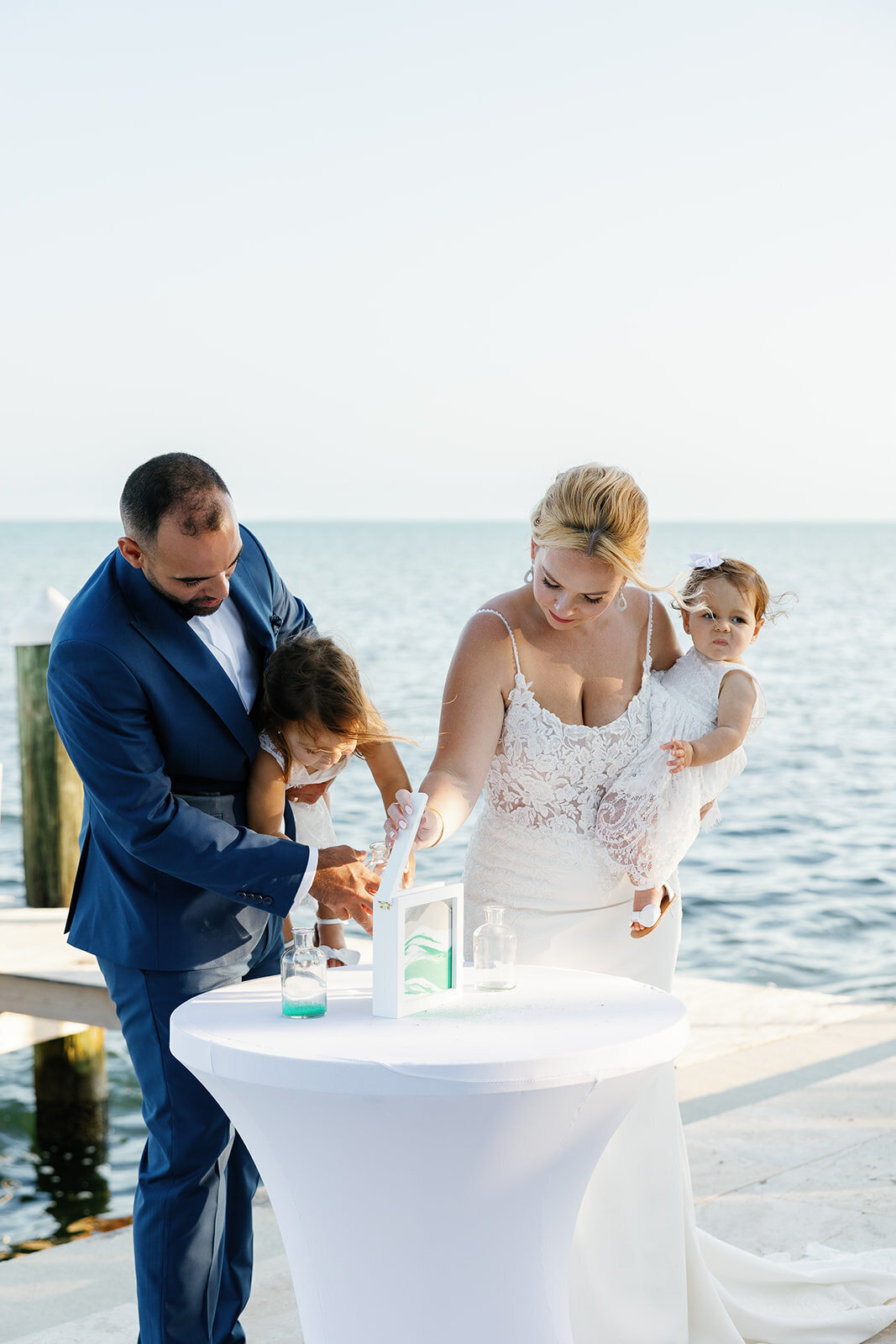 Blending families: Kelly and Rafael’s heartfelt sand ceremony at their Islamorada wedding.