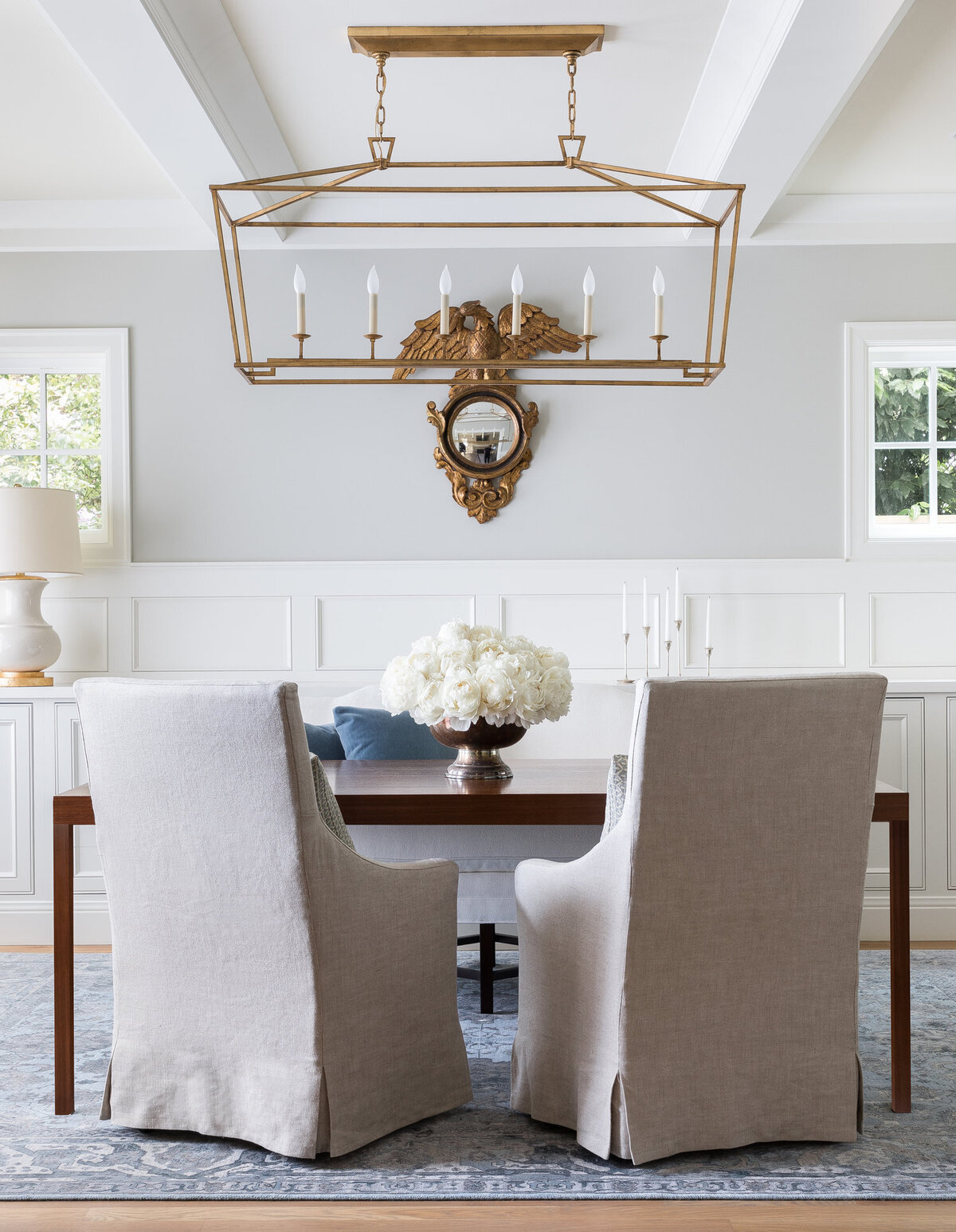 Neutral-office-design-gold-chandelier-gold-antique-mirror