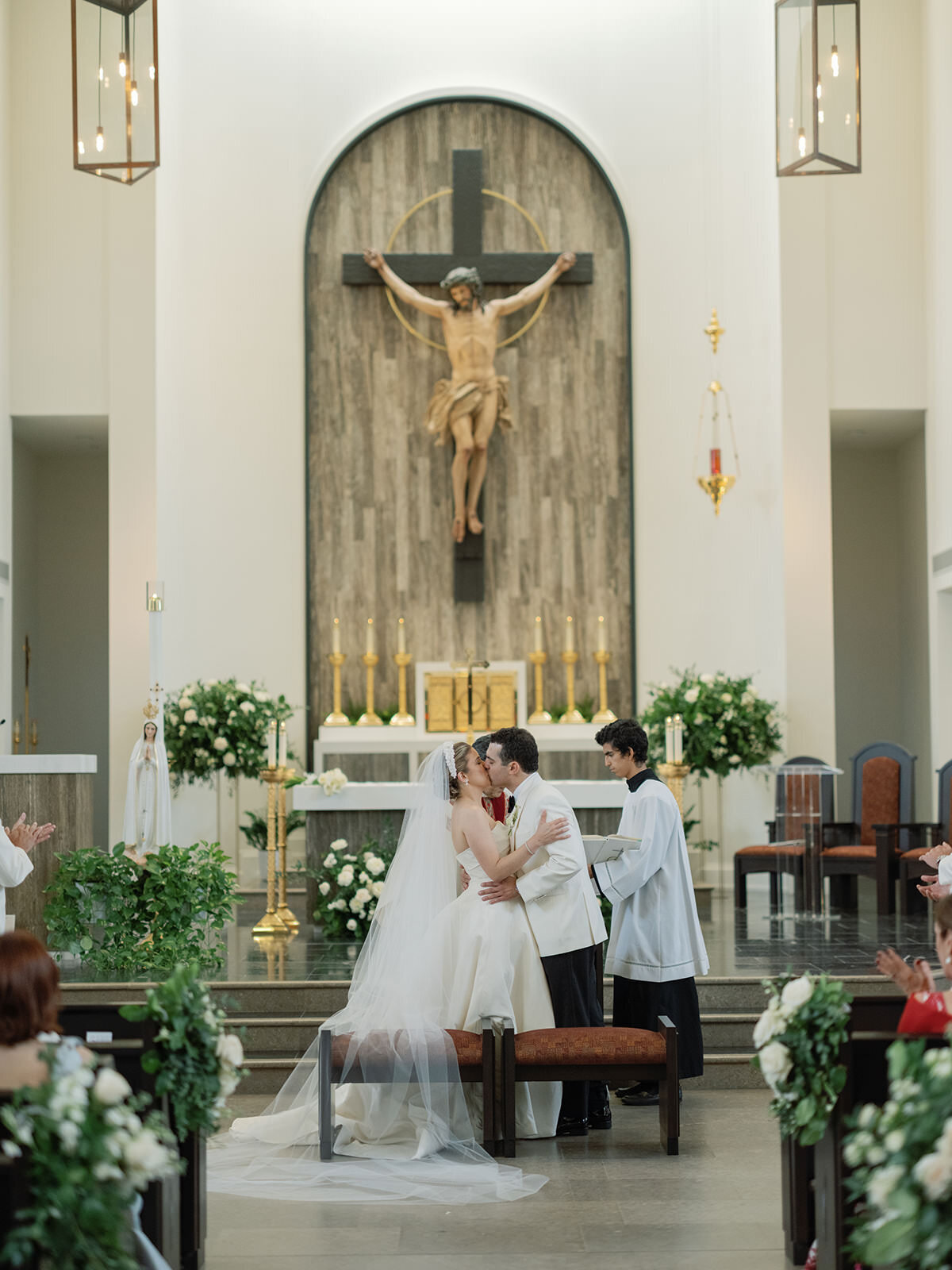 bride-groom-kissing-altar-3GF-W