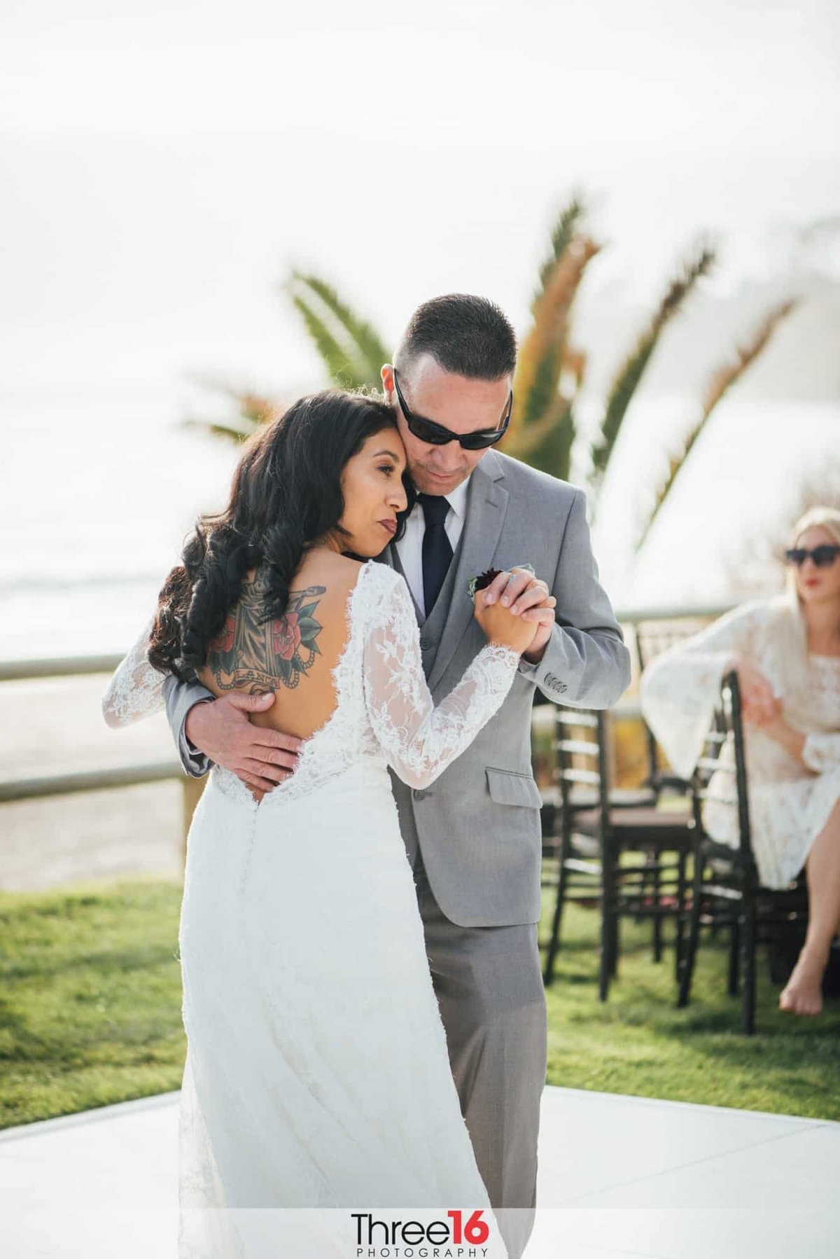 Bride dances with one of her many guests at her wedding reception