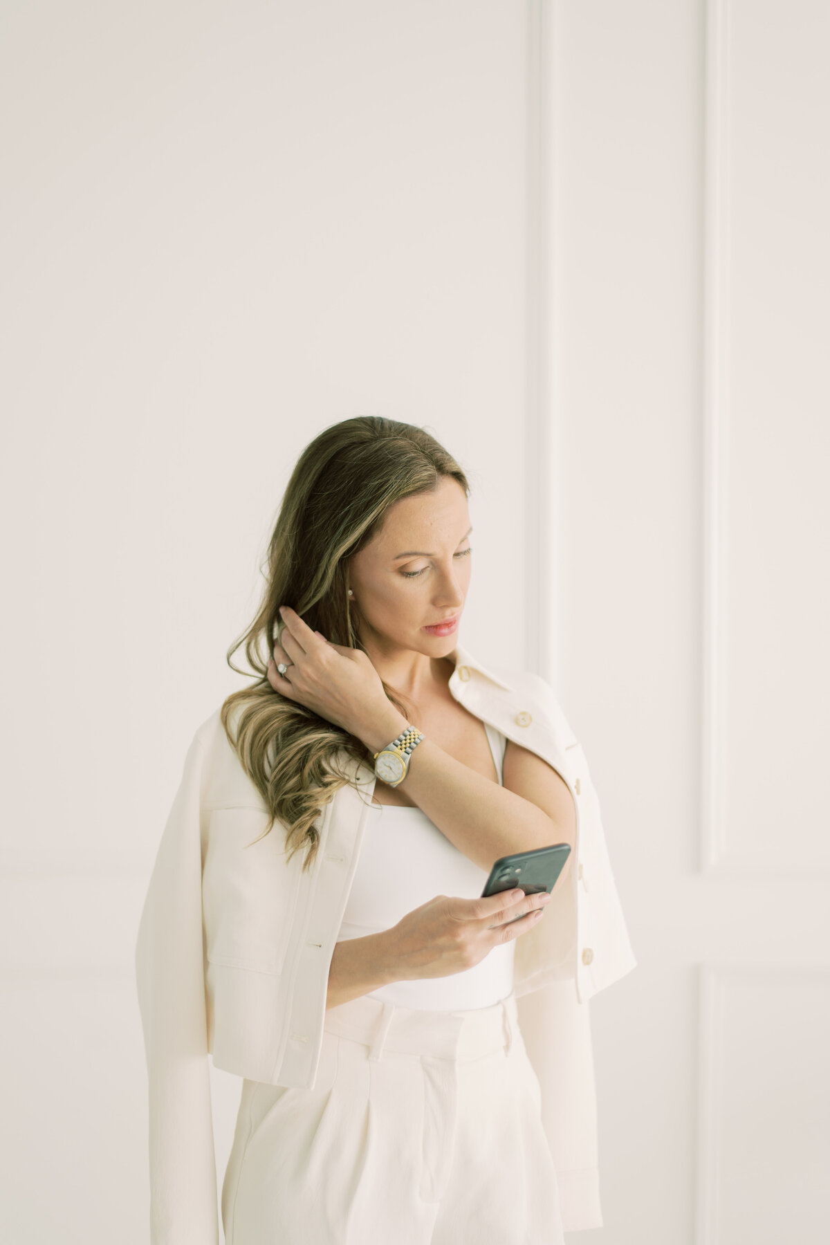 Candid shot of woman looking at phone. Strong, independent 