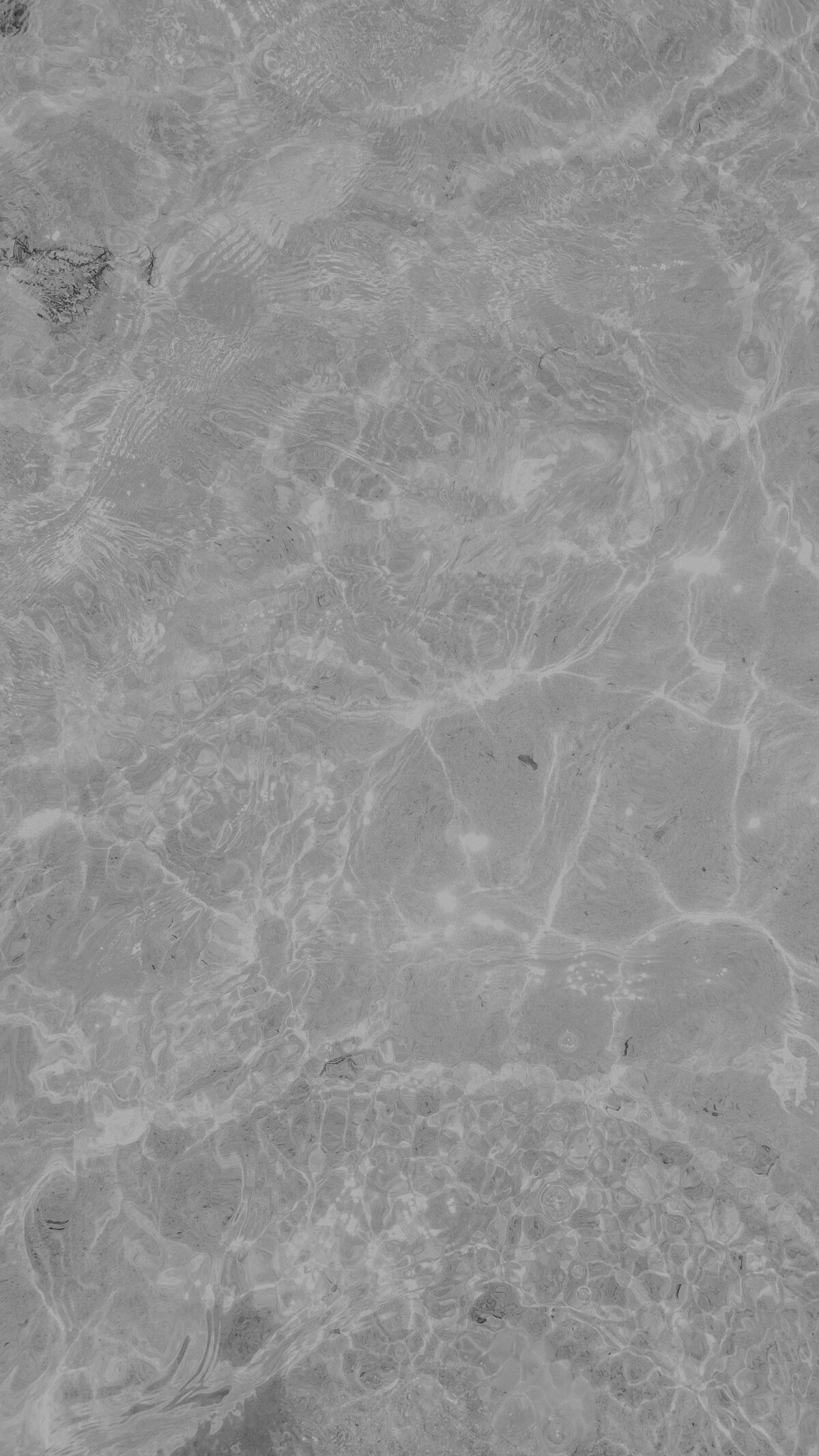 couple on paddle board in ocean