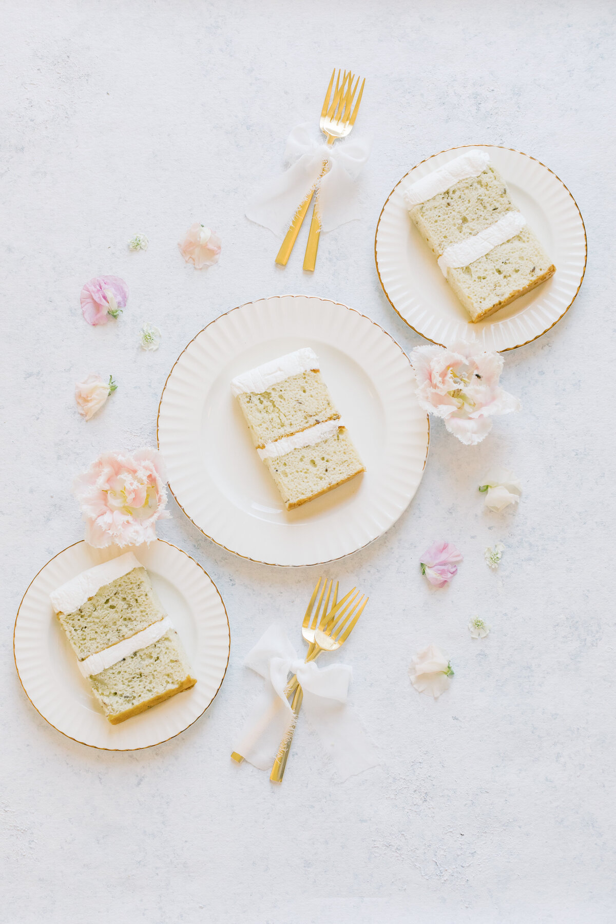 slices-of-gourmet-cake-beautifully-presented-with-gold-cutlery