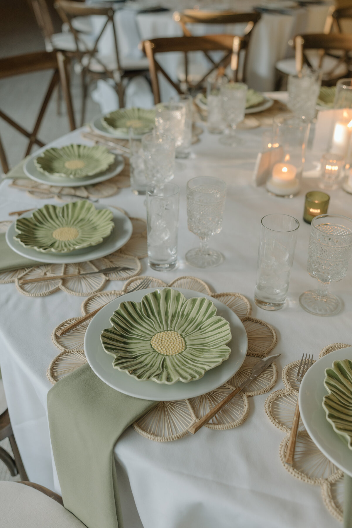 Green flower plates with rattan chargers at Calamigos Ranch 