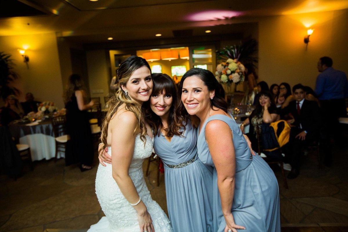 Bride poses with two of her Bridesmaids