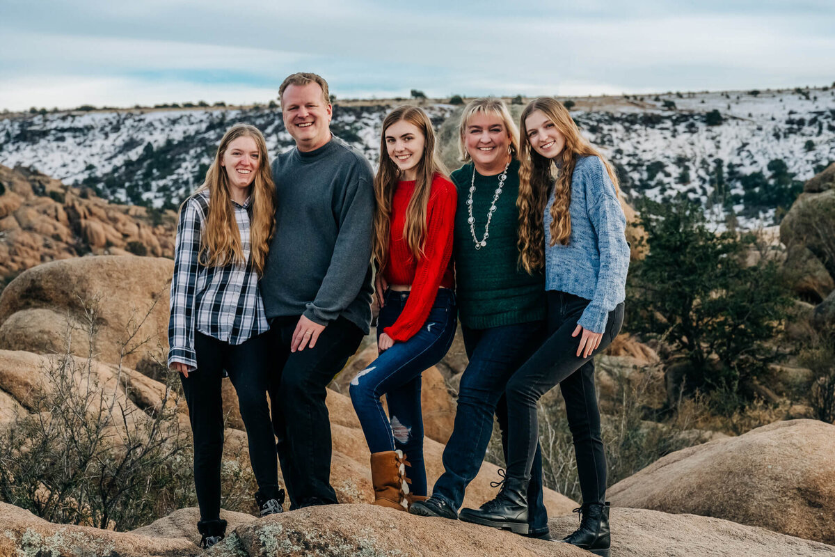 Family poses in snow at Watson Lake for Prescott family photographer Melissa Byrne