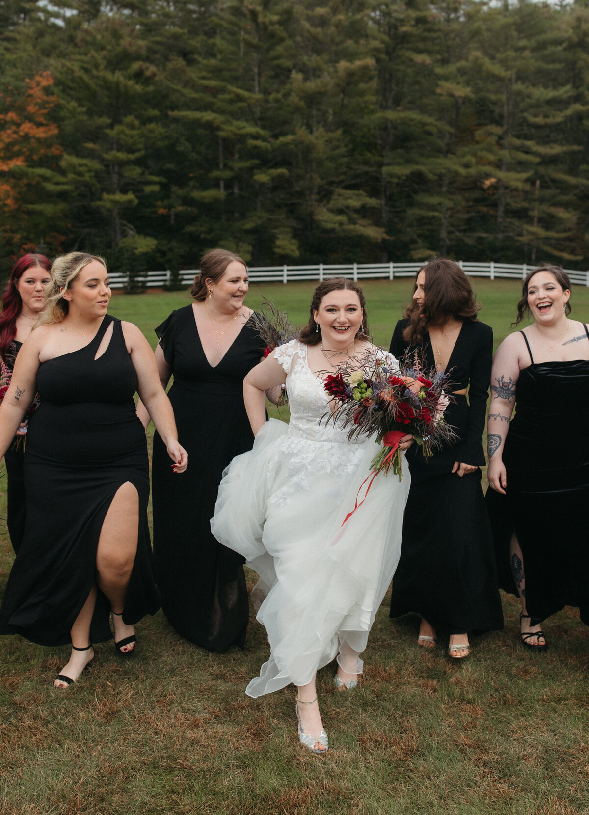 Maine wedding with black dresses and colorful florals