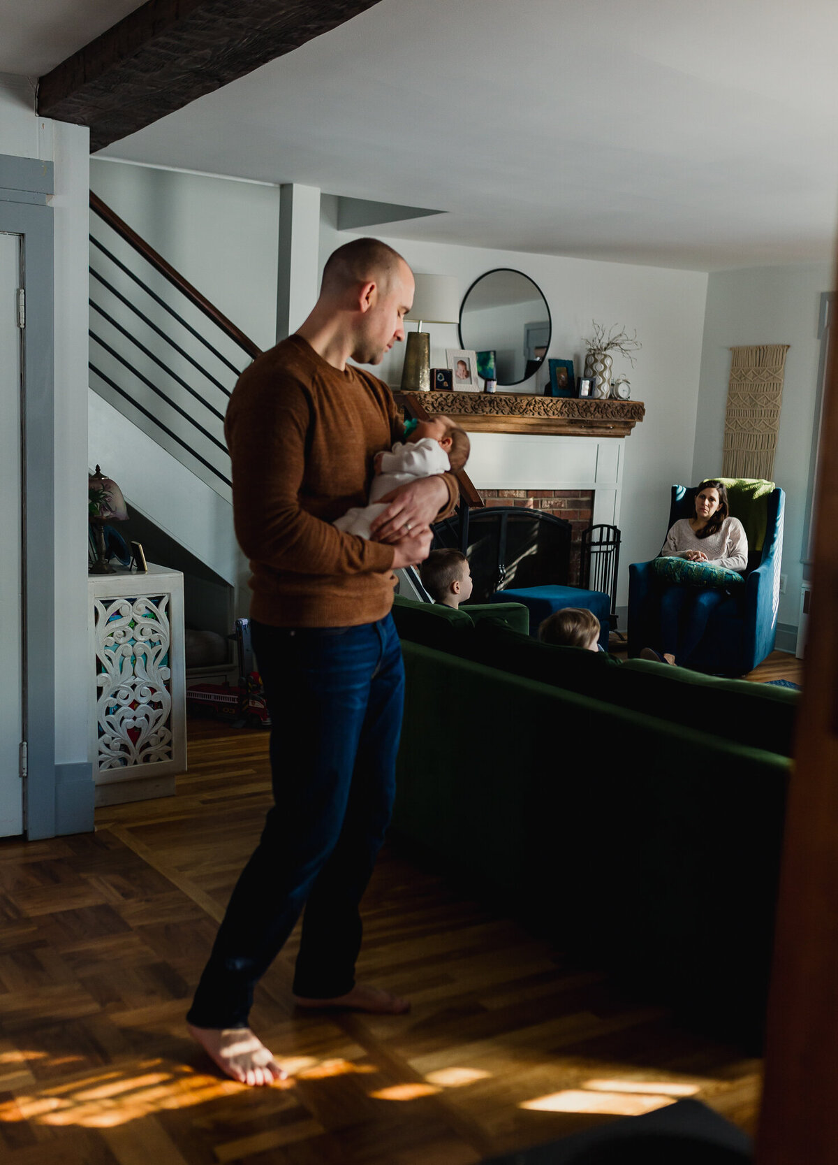 Family Photoshoot Session with dad holding newborn baby.