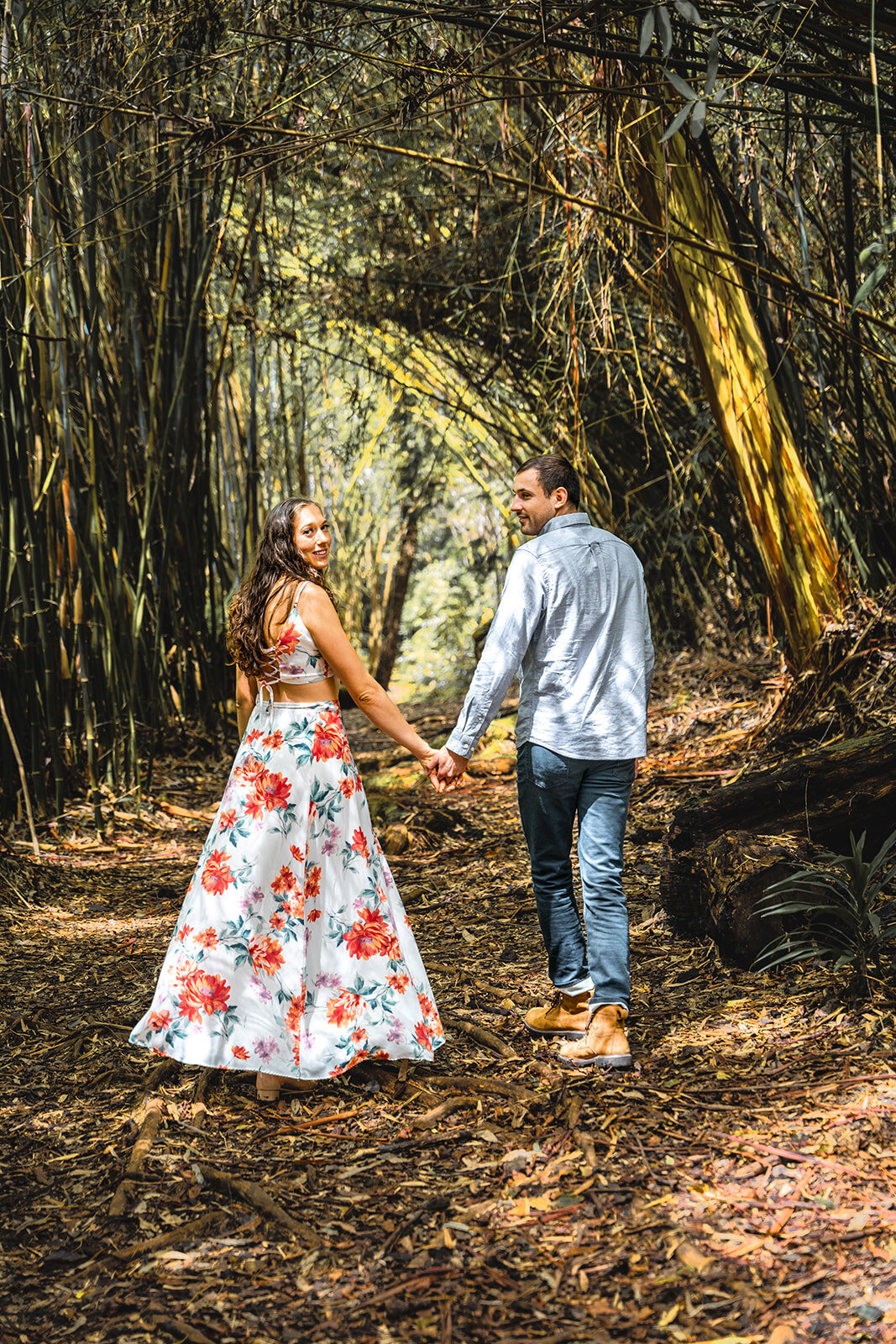 Hawaii couple photography of couple walking through wooded area