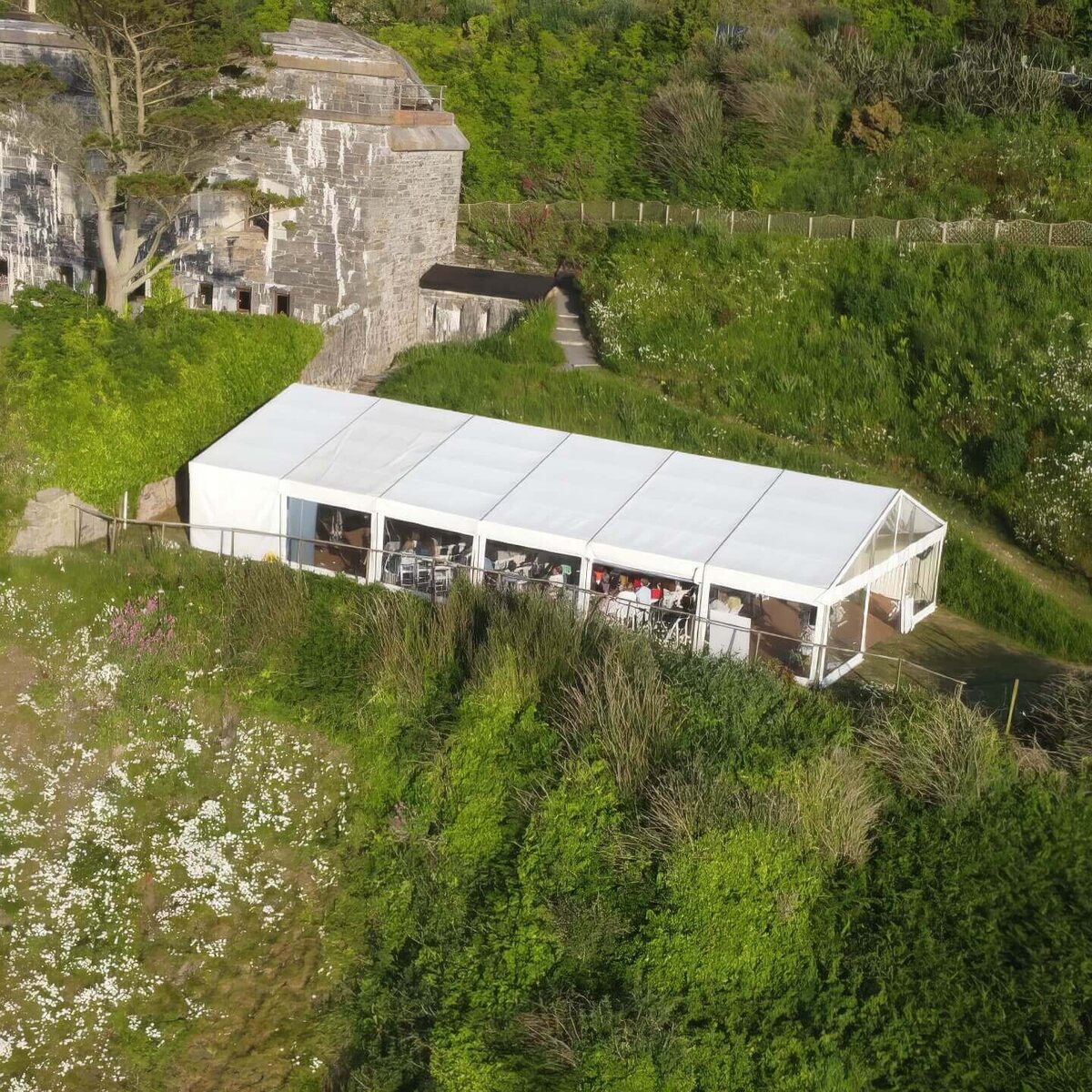 A large white marquee sat in front of the fort