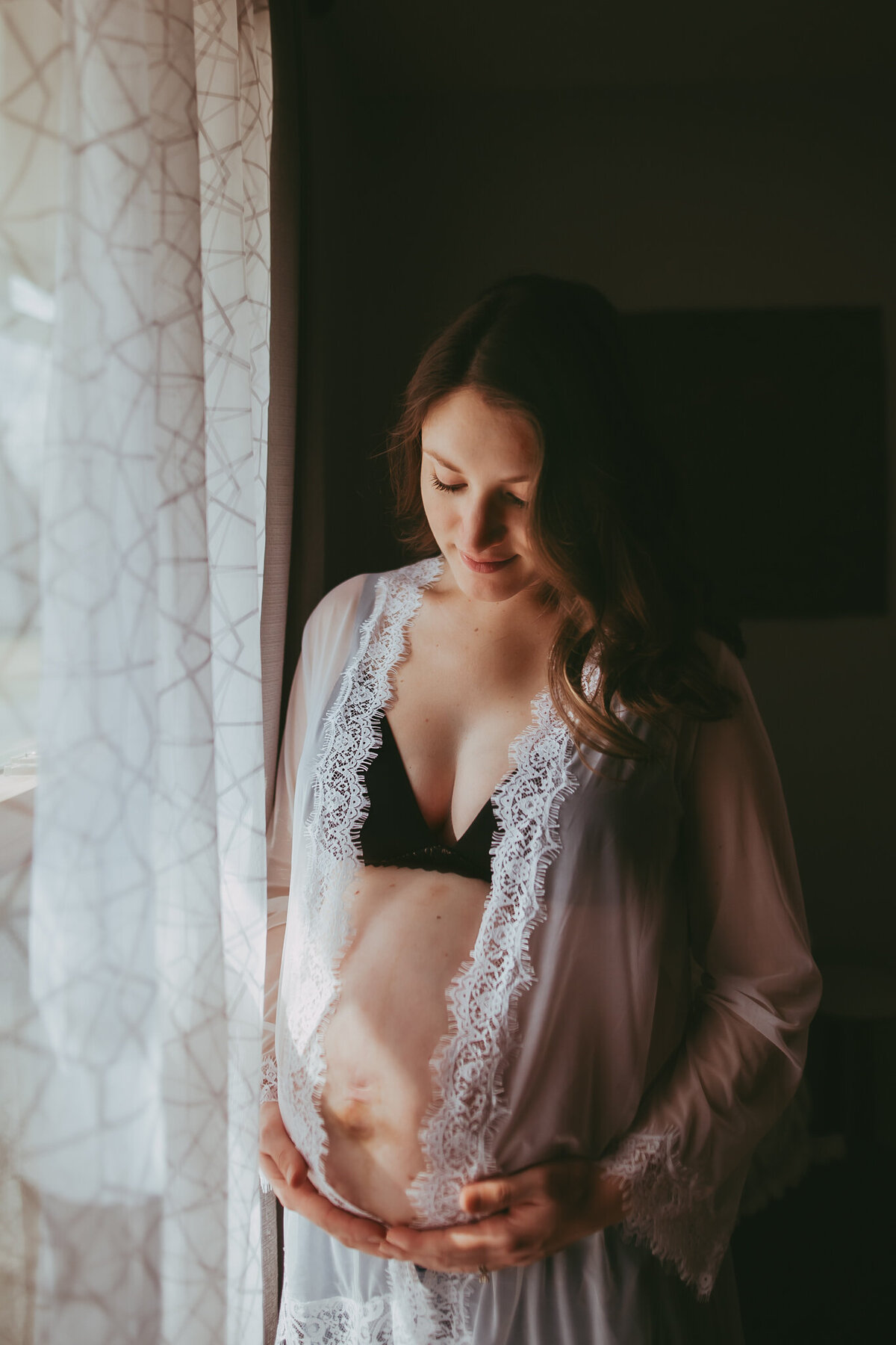 pregnant mama cuddles baby bump