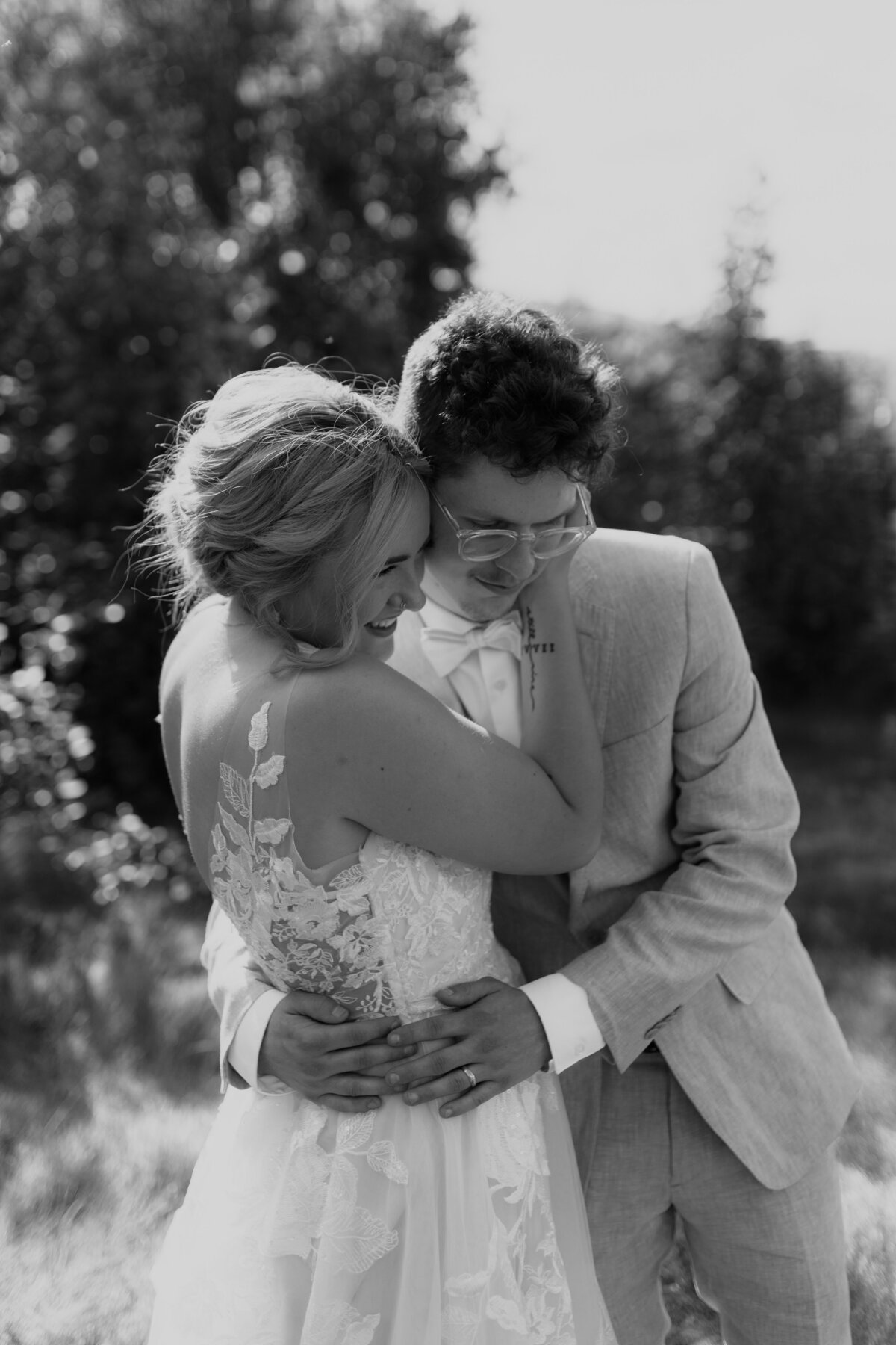 black and white image bride and groom  kissing