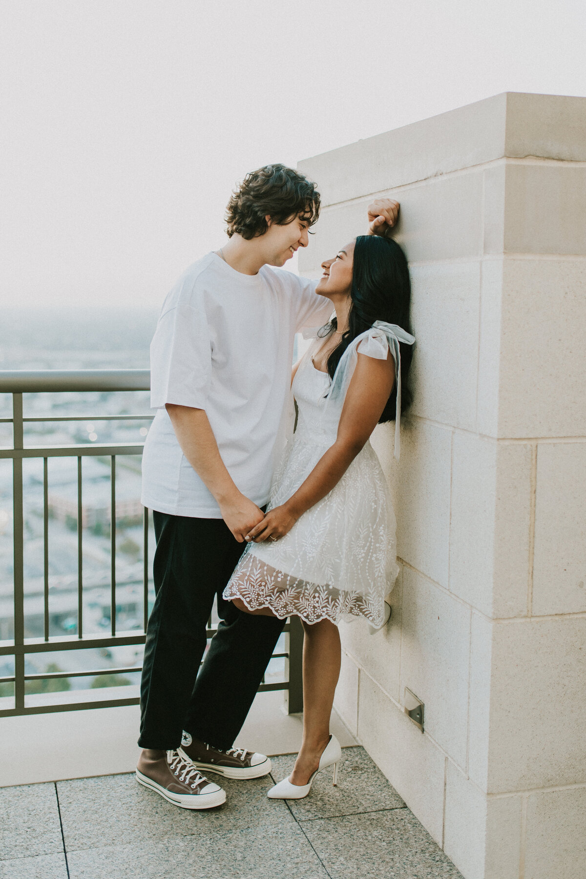 couple on rooftop during engagement photos