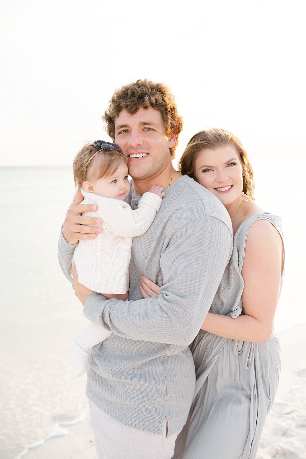 beautiful family at a destin beach by the water